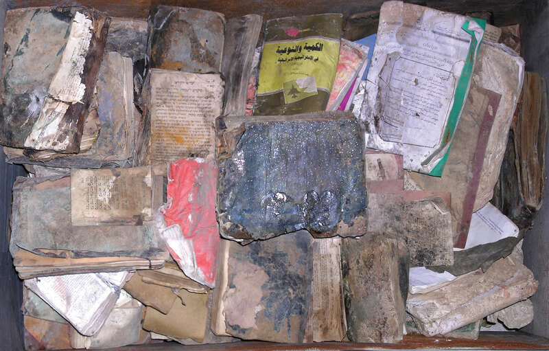 ija-view-of-books-inside-one-of-the-trunks — page 1 · Iraqi Jewish Archive (NARA) · judeoiraq.org